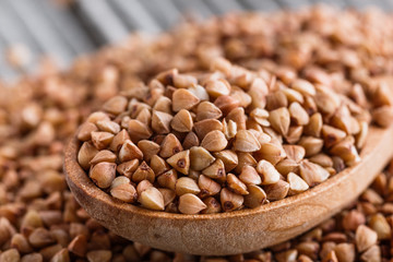 Grain buckwheat on a gray wooden background
