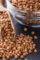 Grain buckwheat on a dark stone background