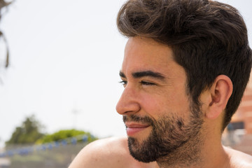 Fototapeta premium young man happy and laughing in the pool