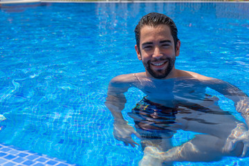 young man relaxed in the pool
