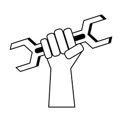 Hand holding wrench construction and repair in black and white