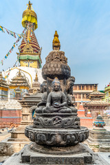 Fototapeta na wymiar Four sitting buddhas in front of the Kaathe Swayambhu ShreeGha Chaitya stupa