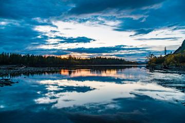 Fototapeta na wymiar Sunset in the forest. Forest by the river. Russia