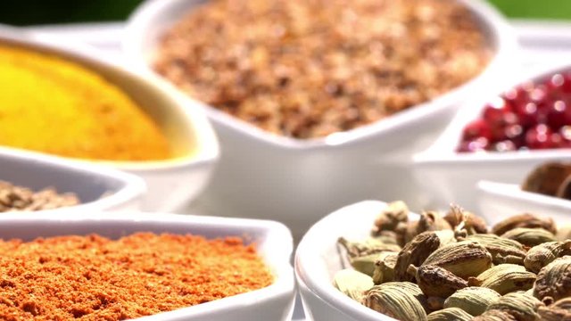 Spices. Various Indian. Spice and herbs rotate. Assortment of Seasonings, condiments. Cooking ingredients, flavor. 4K video Beautiful view