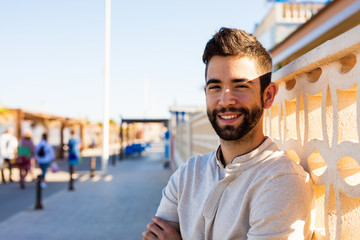 young man smiling outdoors