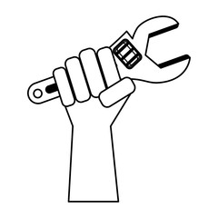 Hand holding tool monkey wrench in black and white