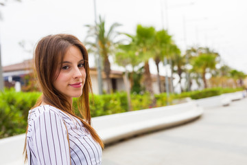 young woman smiling in the city