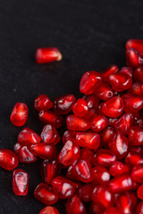 grains of a grenade on a dark rustic background