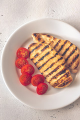 Grilled chicken breast with cherry tomatoes