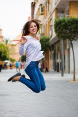 young woman jumping in the city