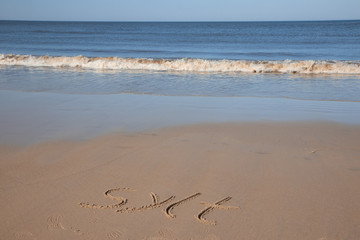 "sylt" written in sand,  beach holiday concept