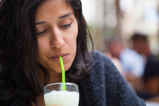 young woman drinking in the bar