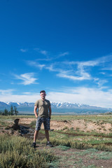 Relaxing man in Kurai steppe on North-Chui ridge