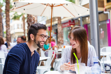 two friends talking in te bar