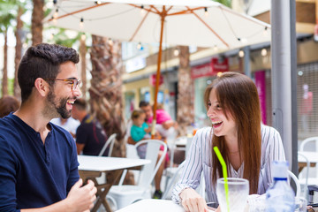 two friends talking in te bar