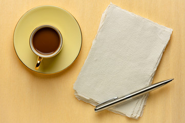 blank sheet of rag paper with coffee