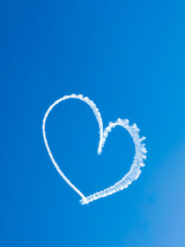 Heart skywriting in blue sky