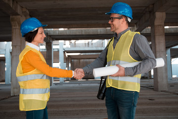 Two architects shaking hands