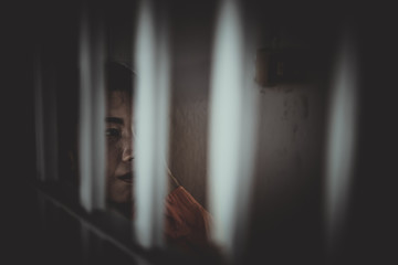 Hands of women desperate to catch the iron prison,prisoner concept,thailand people,Hope to be...