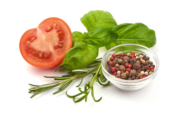 Fresh juicy tomatoes with Sweet basil leaves and spices, close-up, isolated on white background