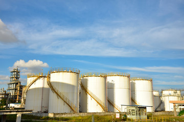 Big white gasoline and oil industry of storage tanks in the blue sky white cloud background