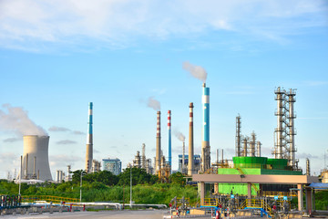 Oil refineries and power plants under the blue sky white clouds