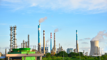 Oil refineries and power plants under the blue sky white clouds