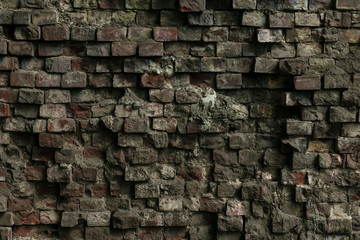 Facade of an old ruined building. Texture of a shattered grunge cement wall. The gray dirty...
