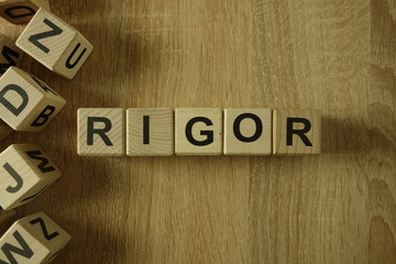 Rigor word from wooden blocks on desk