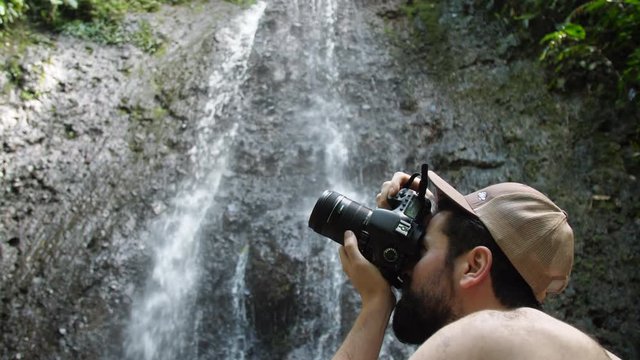 Photographer Taking Photos at Tropical Jungle Waterfall Slow Motion
