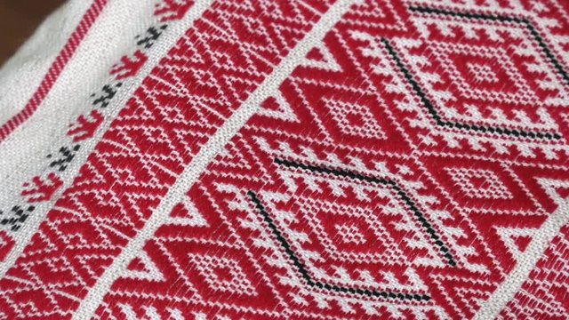Traditional red and black patterns from the countryside. Hand woven fabric.