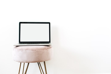 Copy space mockup screen laptop on stylish stool on white background. Minimalist blog, website,...