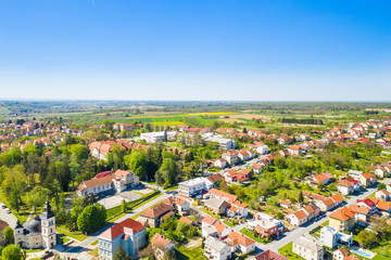 Fototapeta na wymiar Croatia, Slavonia, town of Daruvar, main square and catholic church in spring, panoramic drone view