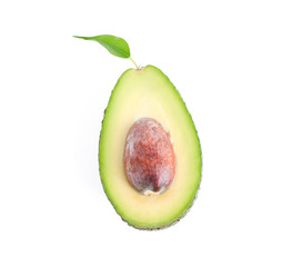 Ripe cut avocado with leaf isolated on white background. Healthy food