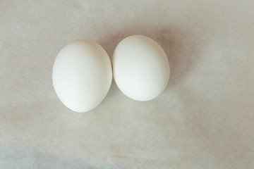 Raw white eggs for Easter celebration. White background. Closeup.