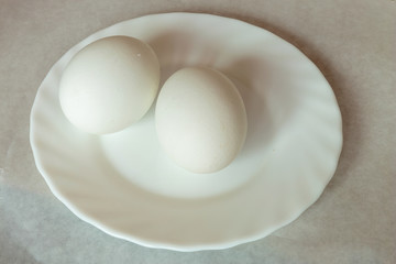 Raw white eggs for Easter celebration. White background. Closeup.