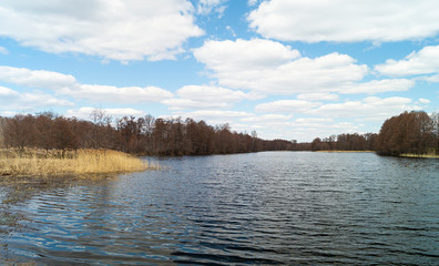 Spring landscape with riverside village