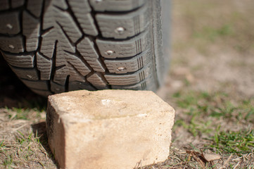 replacement of winter tires on the grass