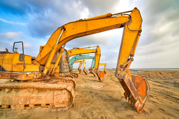Large excavator under the blue sky white clouds