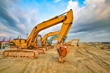 Large excavator under the blue sky white clouds