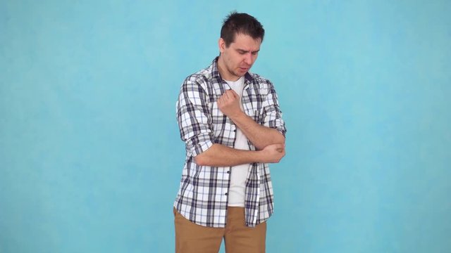 middle-aged man problems and pain in the elbow joint