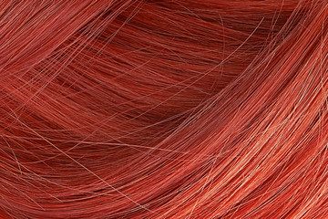 Red hair as background, texture. One of the popular shades of hair coloring