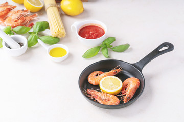 Raw ingredients for cooking: Shrimp prawns Italian spaghetti pasta