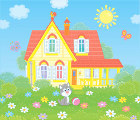Obraz na płótnie Canvas Village house and a small grey kitten playing with butterflies among flowers on green grass of a lawn, vector illustration in a cartoon style