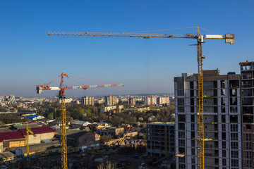 Fototapeta premium Crane and high-rise building