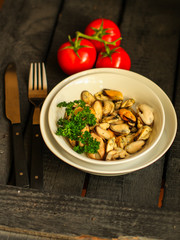mussels A serving of seafood is a white plate. food background. top image