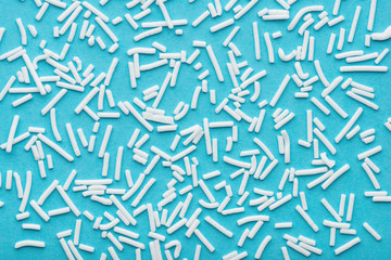 white sprinkles over blue background, festive invitation for Valentines day, birthday, holiday and...