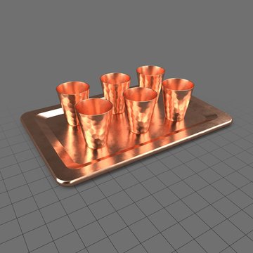Copper shot glasses on tray