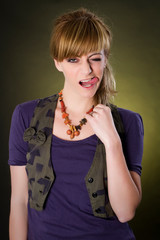 Studio fashion image of gorgeous young woman posing in casual dress.