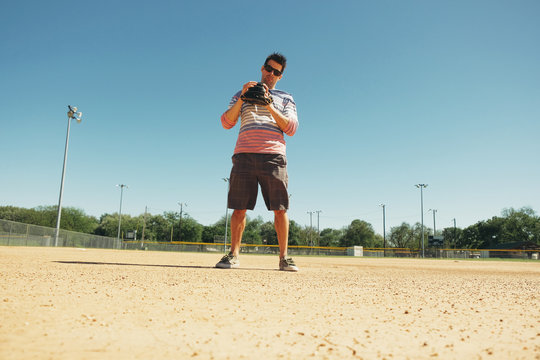 Baseball player on ball field outdoors ready for fun recreation game, sports lifestyle image.